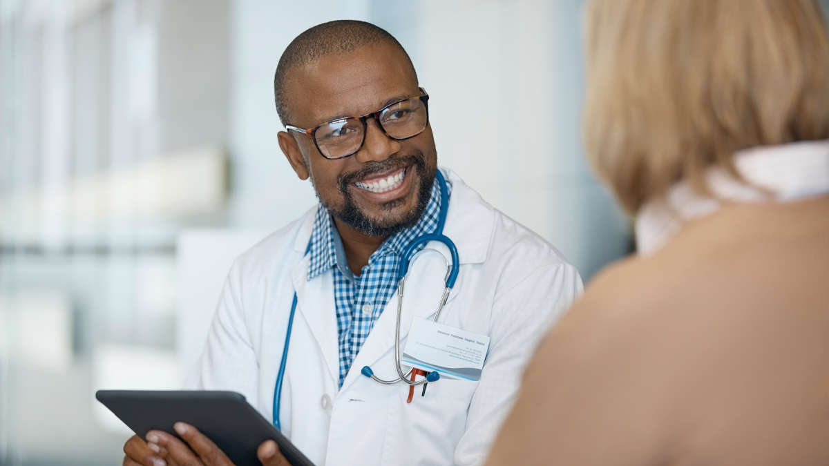 Male doctor talking to a female patient.